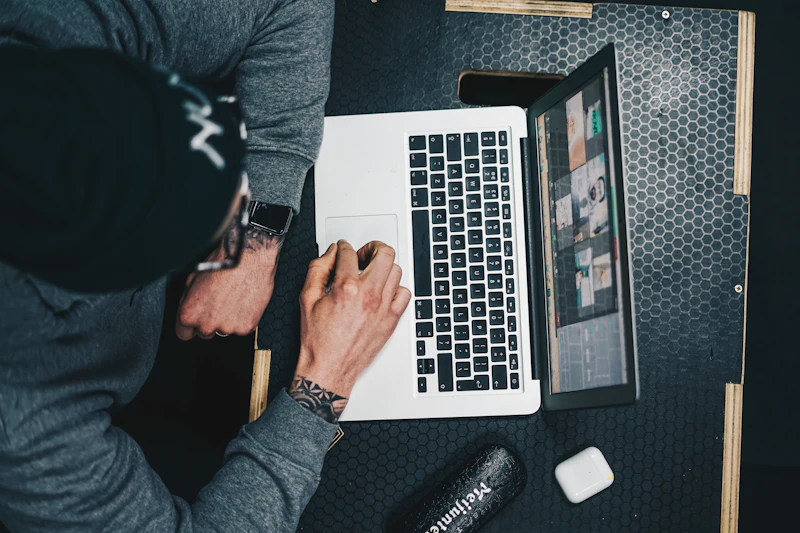 Coach reviewing a client's progress on a laptop